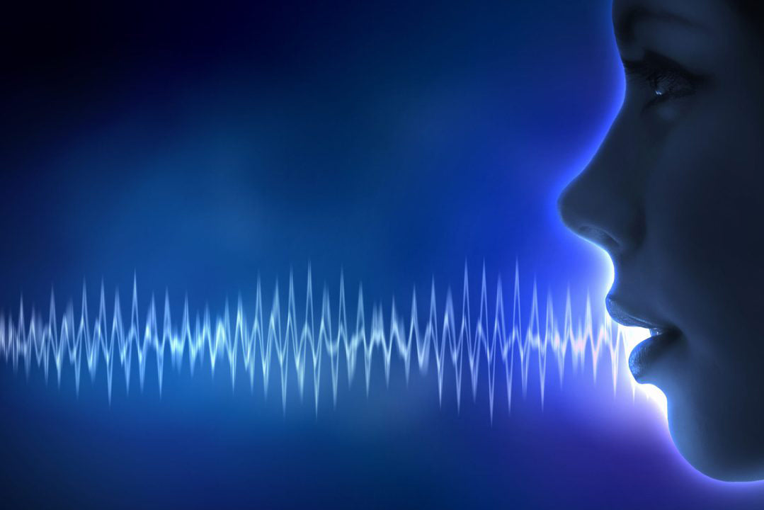 Silhouette of a person's profile with blue sound waves representing clear audio technology.